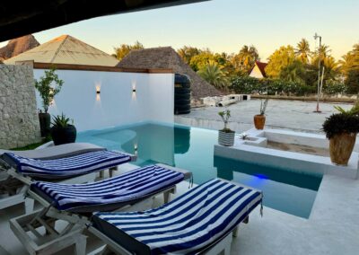 The Penthouse Villa Pool and deck chairs